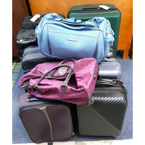 SELECTION OF EIGHT SUITCASES AND TWO HOLDALLS
including North Face, Airways, Pierre Cardin, and Tripp, etc.
Note: Suitcases and bags are empty