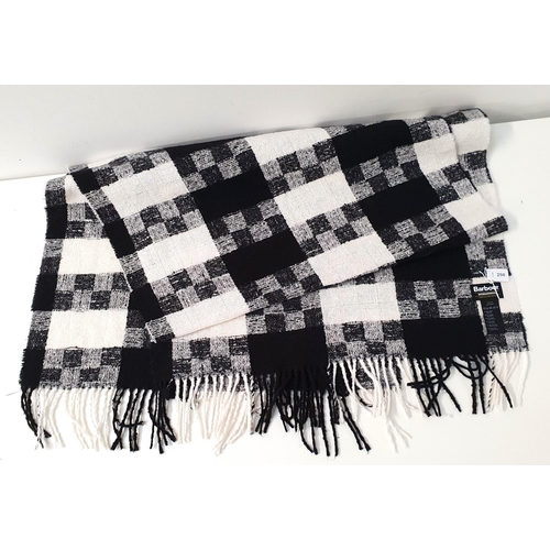 BARBOUR BLACK AND WHITE CHECK SCARF/WRAP
100% polyester, approximately 66cm x 190cm (excluding fringe)