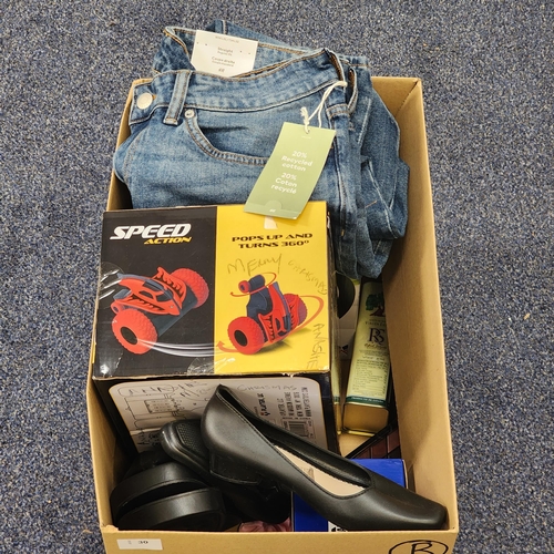 ONE BOX OF NEW ITEMS
including Stingray remote control car, kettle, olive oil, shoes, make up set, and a pair of jeans
