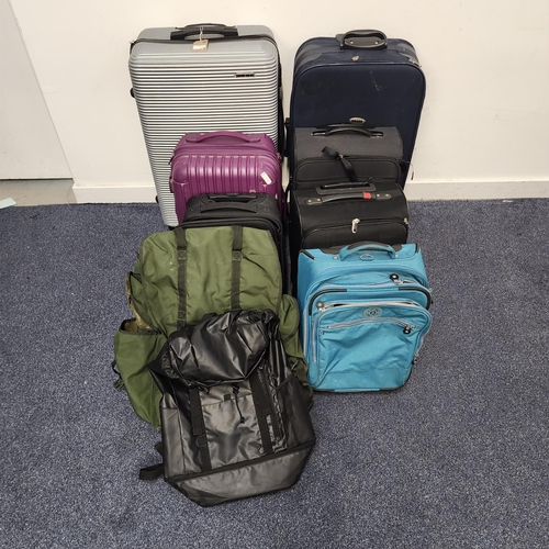 SEVEN SUITCASES AND TWO RUCKSACKS 
including Track, Slazenger, Kipling, Travelway, and Urban (9)
Note: All cases and bags are empty