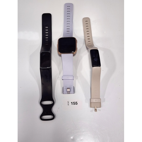 SELECTION OF THREE FITBITS
comprising a Charge 5, Versa 1 and Inspire 2