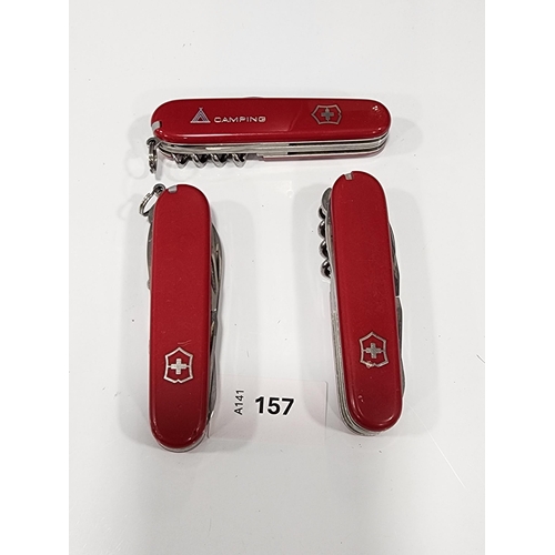 THREE VICTORINOX SWISS ARMY KNIVES
of various sizes and designs
Note: You must be over the age of 18 to bid on this lot.