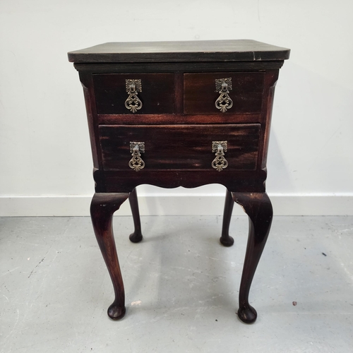 TEAK SIDE TABLE
with two short frieze drawers above a long drawer, standing on cabriole supports, 67cm x 40.5cm x 38.5cm
