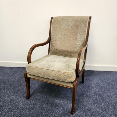 GEORGE III STYLE MAHOGANY OPEN ARMCHAIR
with a padded back and loose seat cushion, standing on reeded sabre supports