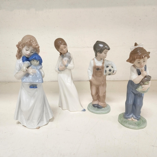 FOUR NAO FIGUREINES
all depicting children, two holding dolls, another a football and the last a puppy, the tallest 20.5cm high (4)