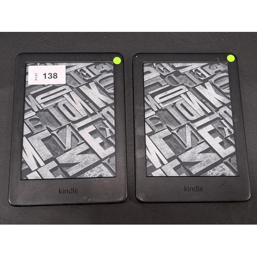 138 - TWO AMAZON KINDLE E-READERS 
comprising a basic 3, serial number G091 0C04 9117 07D0; and a Basic 3,... 