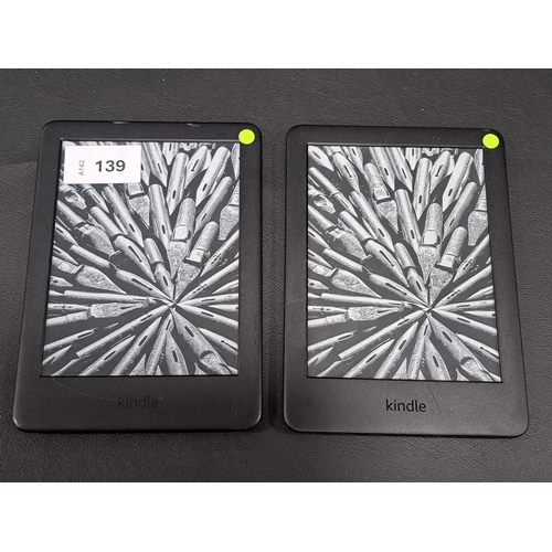 139 - TWO AMAZON KINDLE E-READERS 
comprising a Basic 3, serial numberG090 VB06 1193 08WF; and a Basic 3, ... 