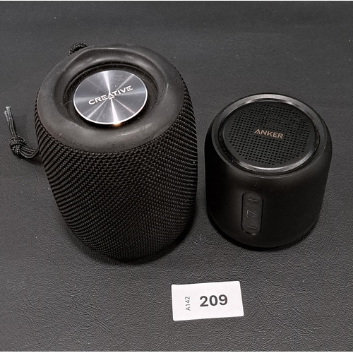 209 - TWO BLUETOOTH SPEAKERS 
comprising a speaker by Creative and an Anker Sound core mini (A3101)