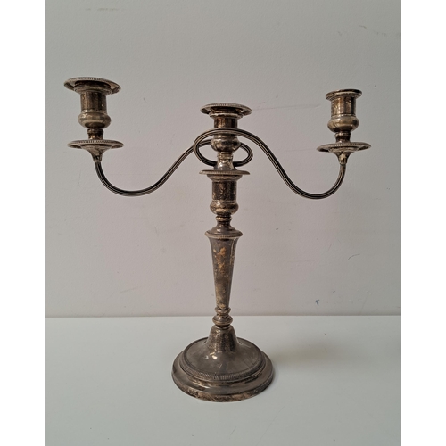 SILVER THREE BRANCH CANDELABRA
the fluted scroll arms raised on knopped stem and circular base, Birmingham hallmarks for 1973, maker Baker Ellis Silver Co., 34.5cm high, the top arm section weighing 646g/22oz, the base (weighted) weighing approximately 680g/23.9oz