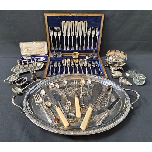 MIXED LOT OF SILVER PLATE
including an oval tray, toast rack, napkin rings, cased set of twelve fish knives and forks, three pepper pots and other items