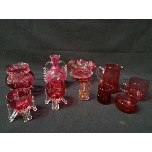 SELECTION OF CRANBERRY AND RUBY GLASS
comprising a pair of salts, small jug, frill rim squat vase, inkwell liner, circular salt liner, two small mugs, crackle vase and a squat vase