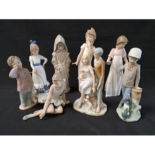SEVEN NAO FIGURINES
comprising seated ballerina, 15cm high, sleepy boy with teddy, 19.5cm high, boy with dog, 22.5cm high, girl with hoop and puppy, 24cm high, to light the way, 26cm high, boy with rain coat and dog, 26.5cm high, and girl in a nightdress, 29cm high, and a similar figure of a husband and wife with two cats, 23cm high (8)