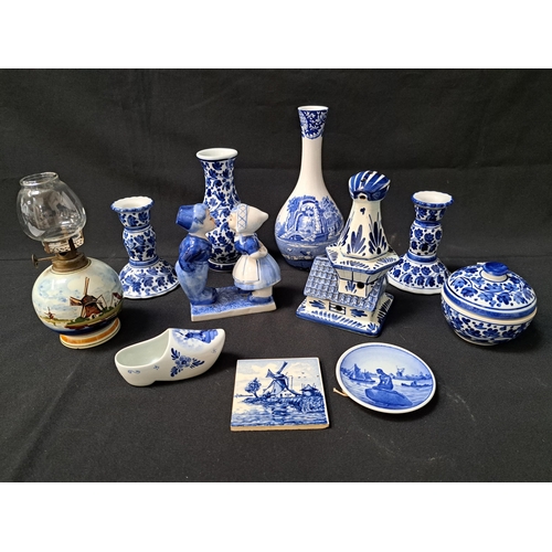 SELECTION OF DELFT AND BLUE AND WHITE CHINA
comprising a small Royal Copenhagen Langelinie plaque, clog, windmill decorated small wall tile, tulip planter, small oil lamp, kissing couple, pair of candlesticks, baluster vase, lidded dish and a Spode baluster vase