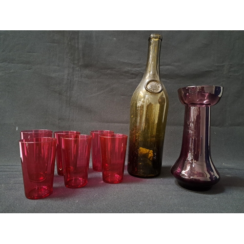 SELECTION OF COLOURED GLASSWARE
comprising a green glass wine bottle marked Haut Sauterne Yquem, six ruby glass beakers and an amethyst glass vase (8)