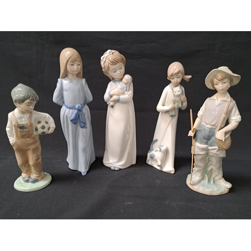 FIVE PORCELAIN SPANISH FIGURINES
comprising a Lladro Gone Fishing 4809, 22cm high, Nao boy with football, 18.5cm high, Nao girl in a blue dress, 24.5cm high, Nao girl with a doll, 24.5cm high and a Casades girl with cats, 22.5cm high (5)