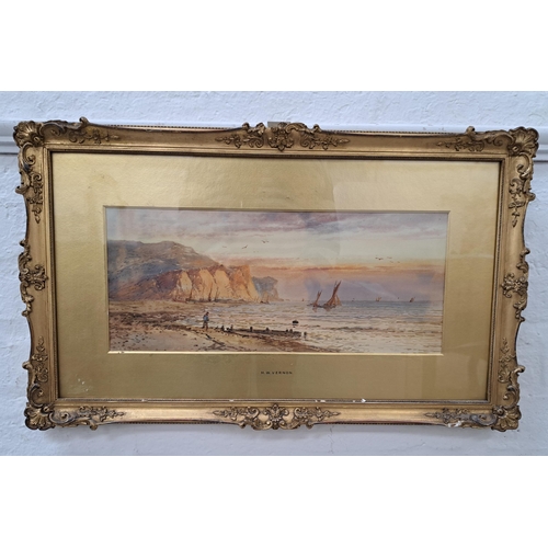 H.W. VERNON
Beach scene with a man standing by the breakwater, watercolour, signed and label to verso, 18.5cm x 44cm