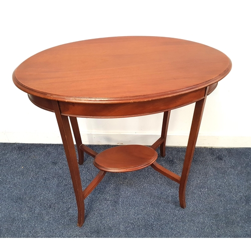 EDWARDIAN MAHOGANY OCCASIONAL TABLE
with an oval moulded top, standing on shaped supports united by an undertier, 72cm high