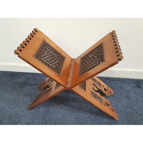ISLAMIC QURAN STAND
of folding X frame design with carved pierced and turned panels, 54cm x 46cm
