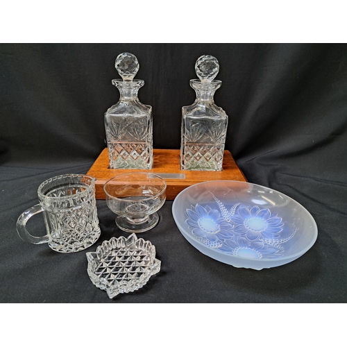 MIXED LOT OF GLASSWARE
including a pair of presentation decanters on a mahogany plinth, chemist bottle, decanter and stopper, two thistle small vases, rose embossed centre bowl and other items
