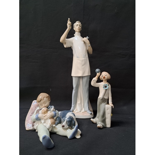 LLADRO PORCELAIN FIGURINE
the dentist, 4762, 35cm high, Lladro figurine sweet dreams, 1535, 18cm long, and a Casades clown, 17cm high (3)