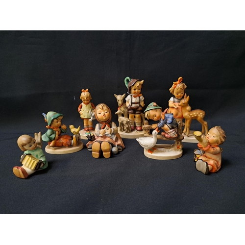 EIGHT GOEBEL FIGURINES
comprising Little goat herder, 13.5cm high, Girl with deer, 13cm high, Boy with goose, 9cm high, Happy pastime, 8.5cm high, Little gardener, 10.5cm high, Singing lesson, 7cm high, Angel making music, 6.5cm high, and Angel playing the accordion, 6cm high (8)