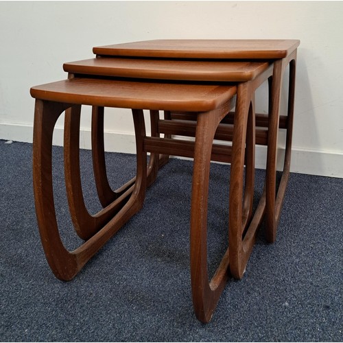 NATHAN TEAK NEST OF TABLES
with a shaped top on continuous supports, 49.5cm high