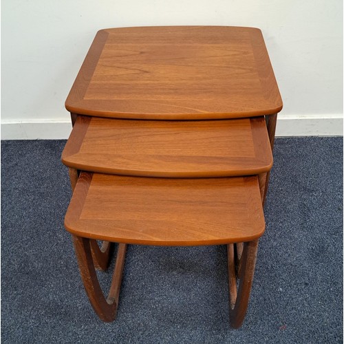 434 - NATHAN TEAK NEST OF TABLES
with a shaped top on continuous supports, 49.5cm high