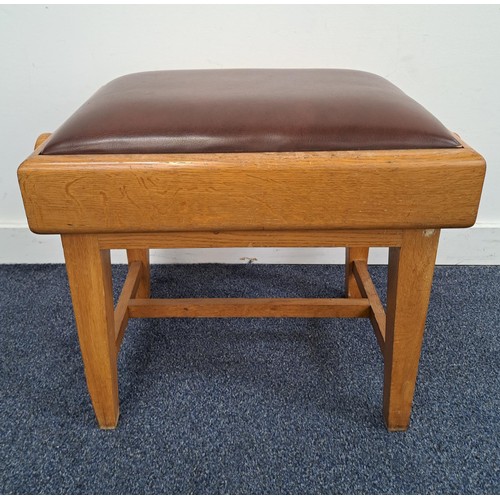 LIGHT OAK PIANO STOOL
with a padded vinyl adjustable seat flanked by winding handles, standing on tapering supports united by a stretcher, 44cm x 58cm x 35.5cm