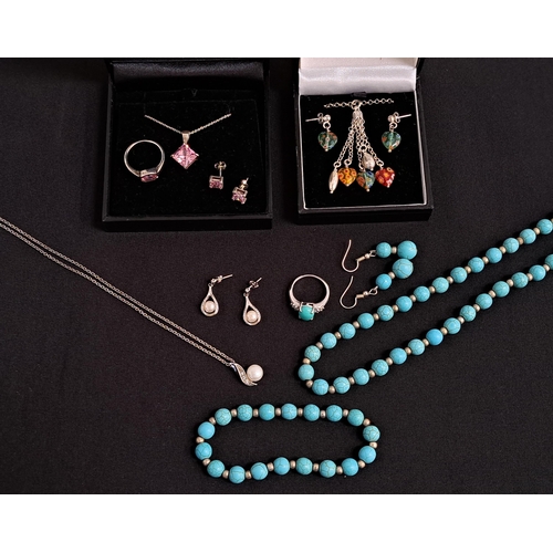 FOUR SUITES OF JEWELLERY
comprising a turquoise bead necklace, bracelet, earrings and ring; a pink CZ set suite set in silver; a pearl and CZ pendant and matching earrings, in silver, the pendant on silver chain; and a millefiori pendant and matching earrings