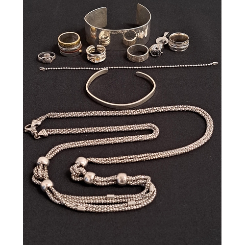 44 - SELECTION OF SILVER JEWELLERY
including a cuff bangle, various rings, a long multi strand necklace, ... 