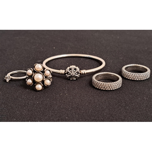 SELECTION OF PANDORA SILVER JEWELLERY 
comprising snowflake clasp bangle, and four rings - Sparkling Heart Solitaire, pearl cluster and two Timeless Pave triple row rings