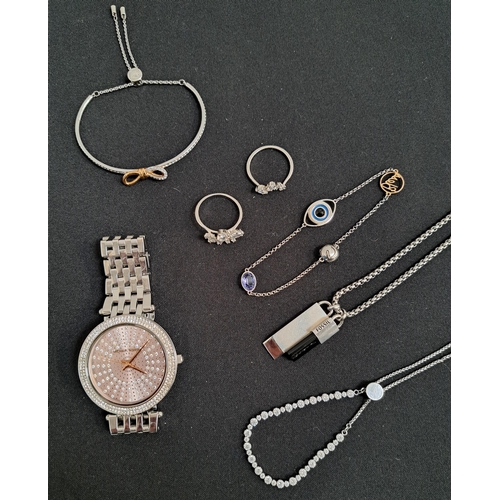 SELECTION OF SWAROVSKI AND OTHER FASHION JEWELLERY 
comprising three Swarovski bangles and two rings, a Michael Kors watch (MK-4407) and a Fossil pendant and chain