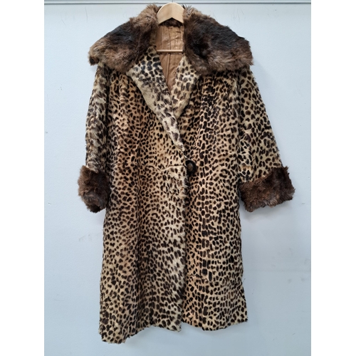 LADIES VINTAGE LEOPARD FUR COAT
with a coney fur collar and cuffs, an internal pocket and one button fastening