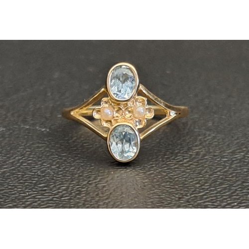 PRETTY BLUE TOPAZ AND SEED PEARL RING
each of the oval cut blue topaz gemstones approximately 0.25cts separated by two small seed pearls, on nine carat gold shank with decorative split shoulders, ring size L