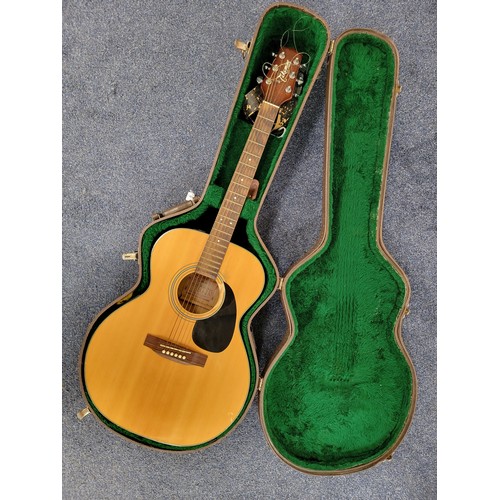 TAKAMINE SIX STRING ELECTRO ACCOUSTIC GUITAR 
model no. EG-230, G series with a natural coloured finish in Hard case