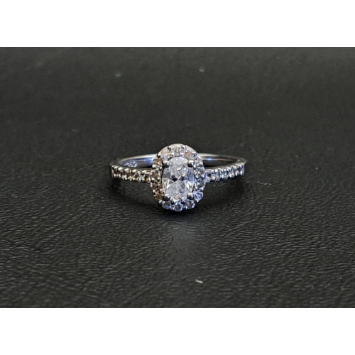 DIAMOND CLUSTER RING
the central oval cut diamond approximately 0.45cts in diamond surround and with further small diamonds to the shoulders, total diamond weight approximately 0.7cts, on platinum shank, ring size M and approximately 4.1 grams