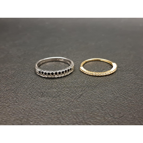 TWO CZ SET RINGS
one with white and black stones set in eighteen carat white gold, ring size N and approximately 2.7 grams; and the other in nine carat yellow gold, ring size K and approximately 0.7 grams