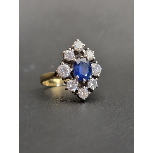 IMPRESSIVE SAPPHIRE AND DIAMOND CLUSTER DRESS RING
the central oval cut sapphire approximately 1ct, in eight diamond surround, the two side flanking diamonds each approximately 0.25cts and the others 0.15cts (in all approximately 1.4cts), on eighteen carat gold shank, ring size  L and approximately 5.8 grams