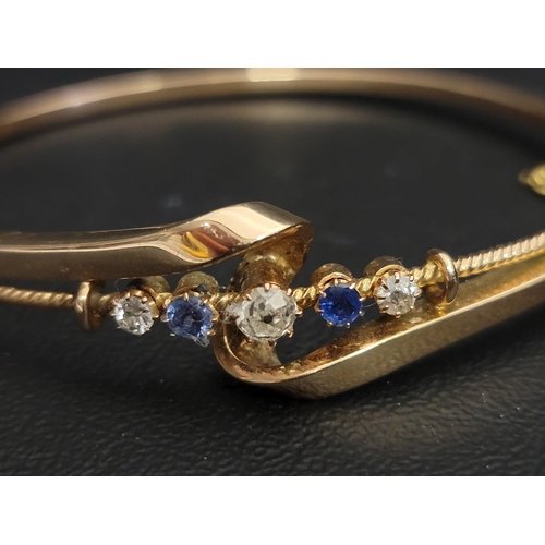 117 - EARLY 20th CENTURY DIAMOND AND SAPPHIRE SET BANGLE
the five graduated gemstones in attractive twist ... 