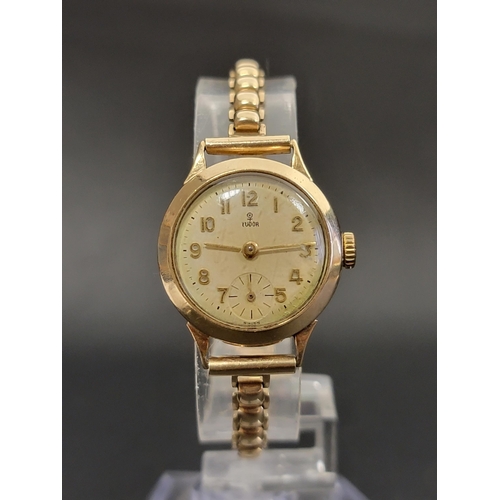 LADIES TUDOR NINE CARAT GOLD WRISTWATCH
circa 1960s, the round dial with Arabic numerals and subsidiary seconds dial, with 17 rubies movement, on nine carat gold strap