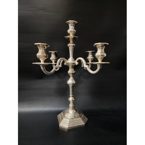 PORTUGUESE SILVER CANDELABRA
raised on a stepped octagonal base with a central 
shaped column and four scroll arms, marked FMT, 925, 47cm high