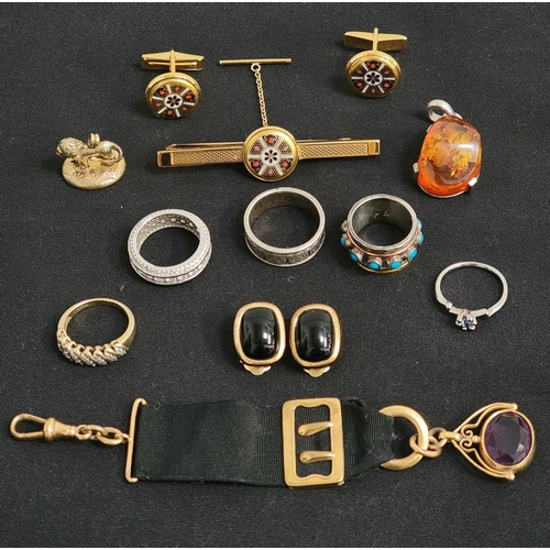 SELECTION OF JEWELLERY
comprising a pair of Christian Dior clip-on earrings, a pair of Royal Crown Derby cufflinks and tie-slide (with certificate), silver and other rings, a silver mounted amber pendant, a bloodstone set lion shaped fob, and another fob on black ribbon