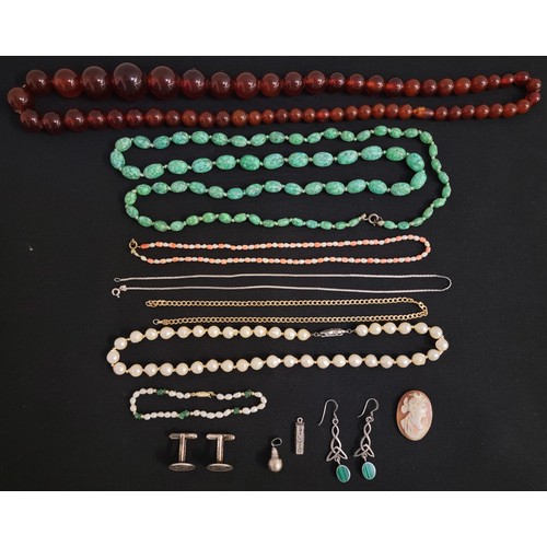 GOOD SELECTION OF JEWELLERY
comprising an amber bead necklace, mottled green glass bead necklace, peal necklace, a coral and seed pearl necklace, a carved shell cameo panel, a pair of coin cufflinks, a pair of stone set silver earrings, a black pearl pendant, etc.