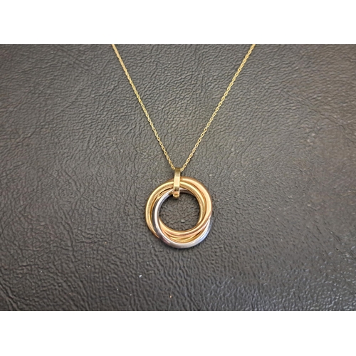 NINE CARAT THREE TONE GOLD PENDANT
in the form of an entwined Russian wedding ring, the white gold ring set with CZ, on nine carat gold chain, total weight approximately 2 grams