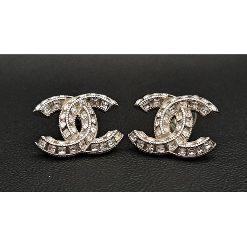 PAIR OF CHANEL CC PASTE SET EARRINGS
in silver tone, both with marks to reserve