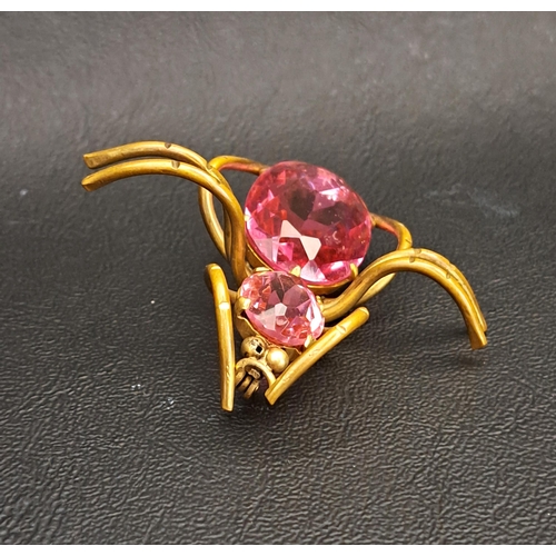 VINTAGE SPIDER BROOCH
set with two graduated faceted pink glass sections, 5cm wide