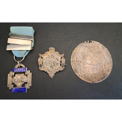 SILVER AND ENAMEL DECORATED LONG SERVICE MEDAL FROM THE NATIONAL OPERATIC AND DRAMATIC ASSOCIATION
hallmarks for Birmingham 1970; together with a silver CCC United medal, hallmarks for Glasgow 1900 and marked Govan; and a white metal disc engraved with Masonic motifs to both sides (3)