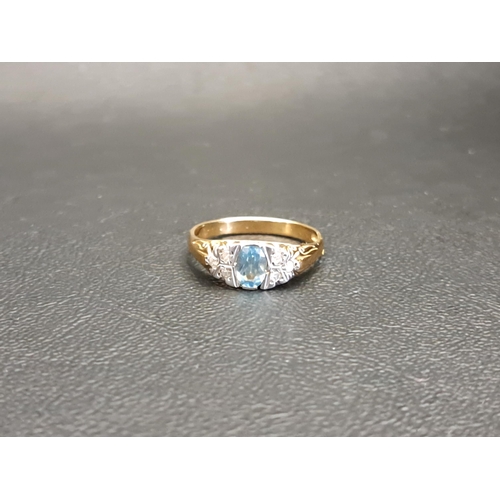 BLUE TOPAZ AND DIAMOND RING
the central oval cut topaz approximately 0.5cts flanked by three diamonds to each side, on nine carat gold shank, ring size O and approximately 3.3 grams