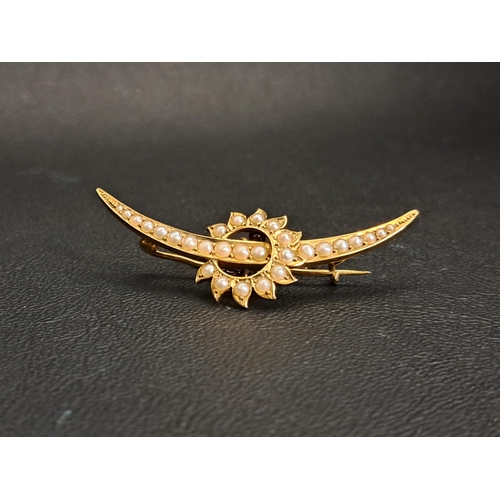 43 - VICTORIAN/EDWARDIAN SEED PEARL SET BROOCH
in the form of a crescent moon and stylised sun, in fiftee... 