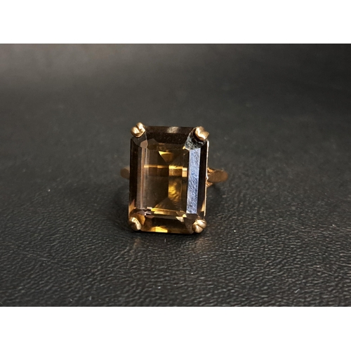 SMOKY QUARTZ DRESS RING
the emerald cut quartz stone measuring approximately 17.8mm x 12.9mm x 7.7mm, on nine carat gold shank, ring size O and approximately 6.3 grams